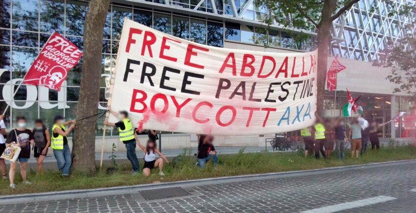 Belgien: „Free Abdallah, Free Palestine, Boycott Axa“